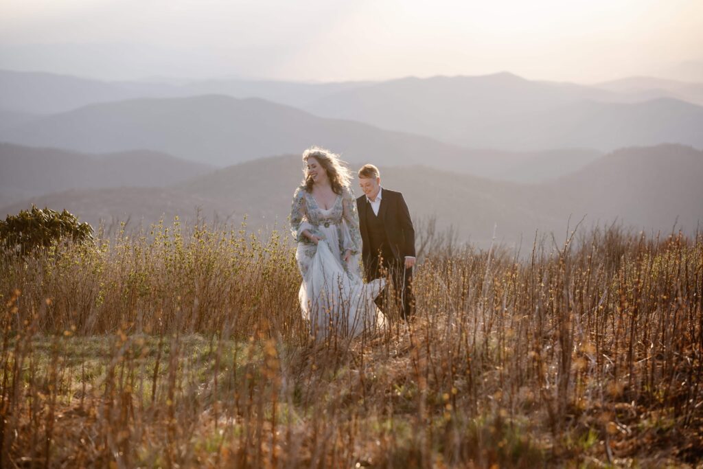 LGBTQ+ couple walking in the Blue Ridge Mountains after eloping.