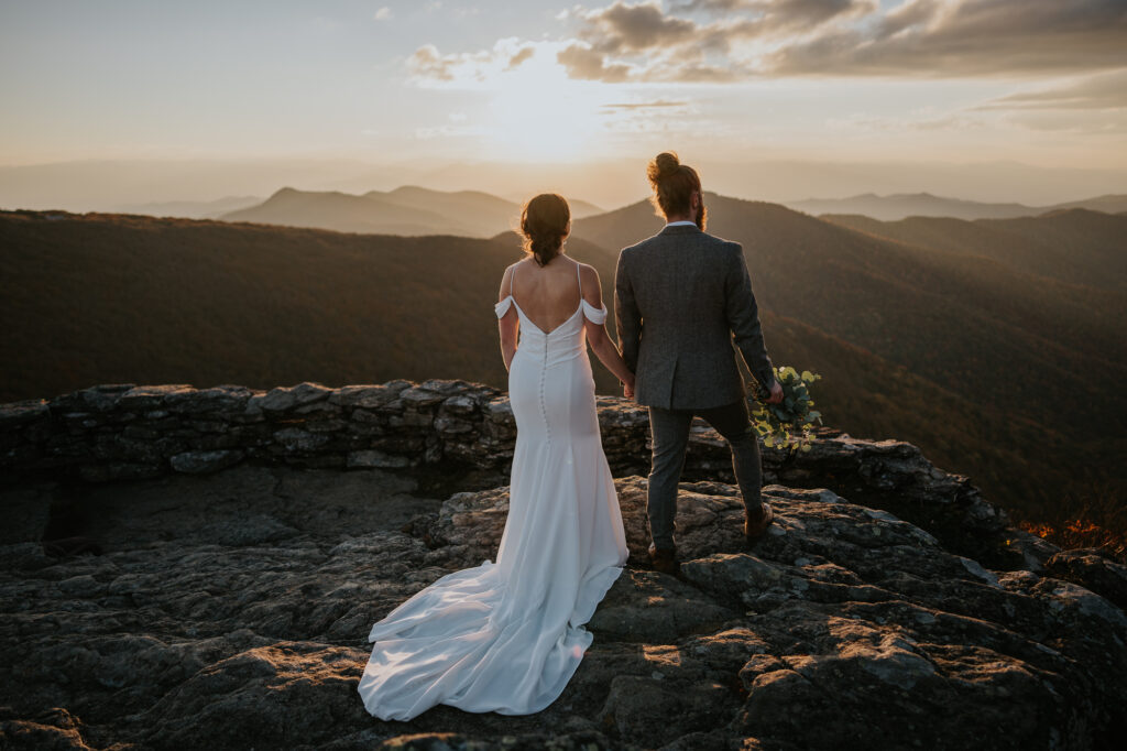 Couple looking out over the Blue Ridge Mountains after their elopement along the Blue Ridge Parkway