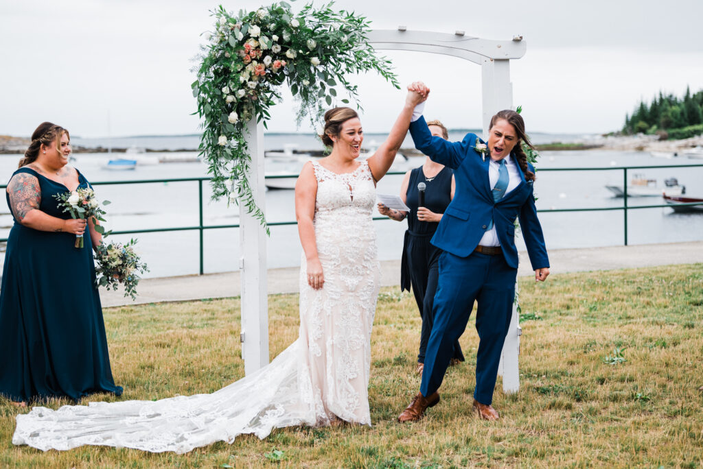 LGBTQ couple celebrating after their wedding