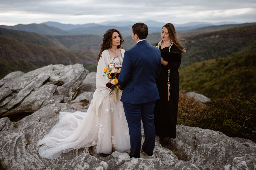 An officiant performing a mountaintop elopement ceremony in Western North Carolina