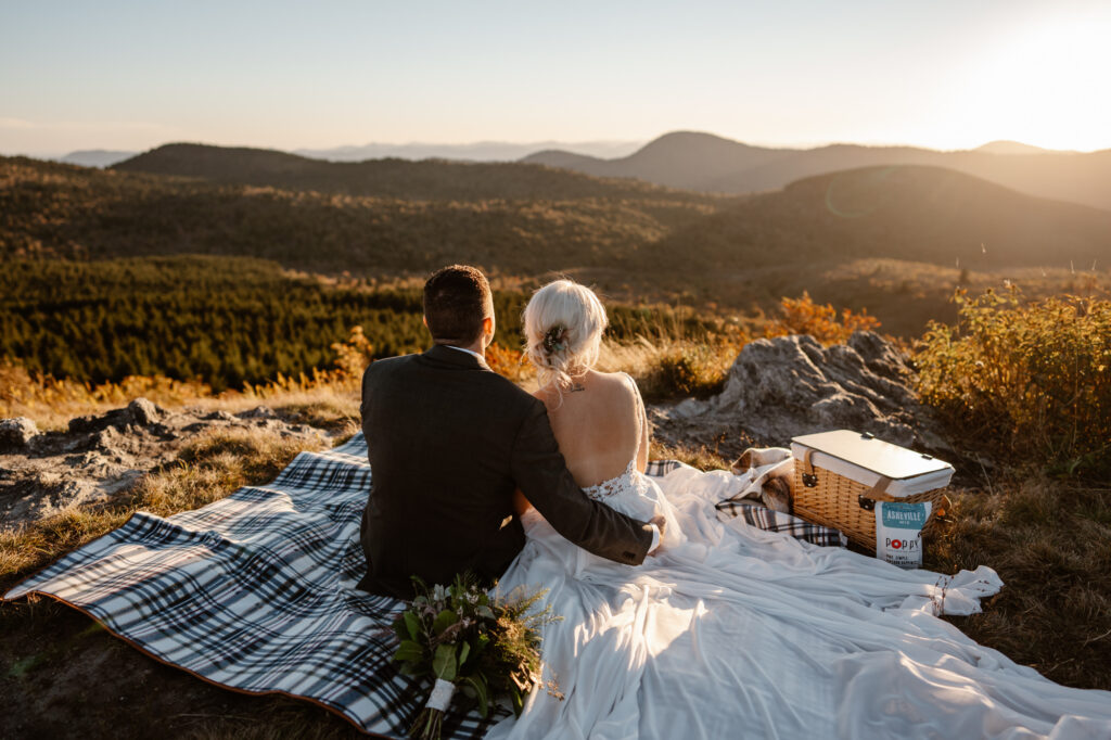 Couple enjoying a picnic while looking out over the Blue Ridge Mountains along the Blue Ridge Parkway